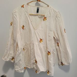 Top with embroidered flowers